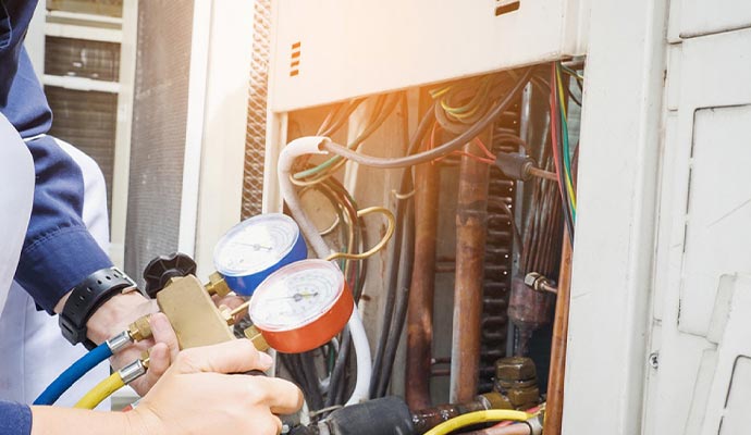 Professional worker checks AC unit