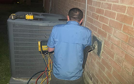 Expert technician repairing air conditioning system
