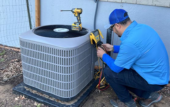 Technicina maintaining air conditioning system