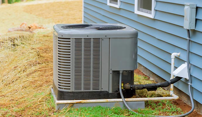 Installed AC unit outside home