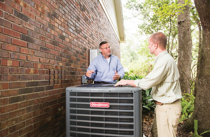 Expert explaining HVAC problems to the owner.