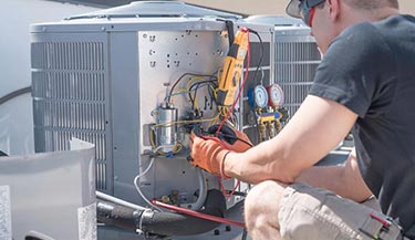 Professional worker inspecting heating system