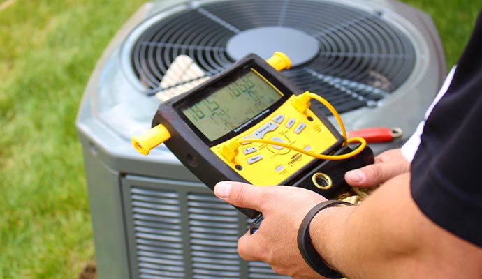 Professional worker inspecting Heating system