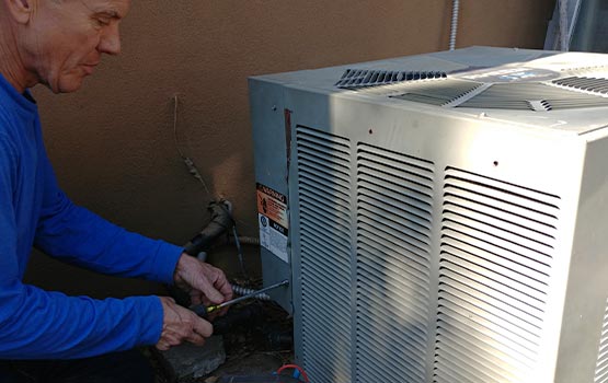 Professional worker repairing heating system