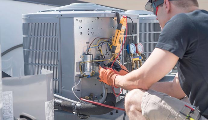 Worker inspecting heating system