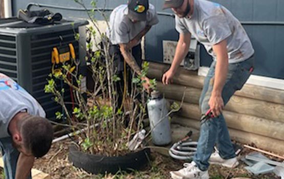Professional worker replacing heating system