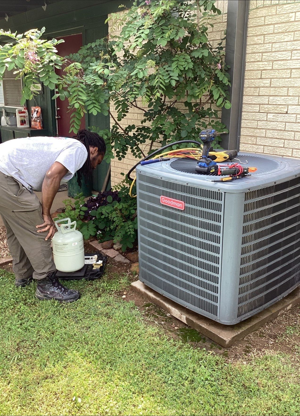 Adding refrigerant to condenser.