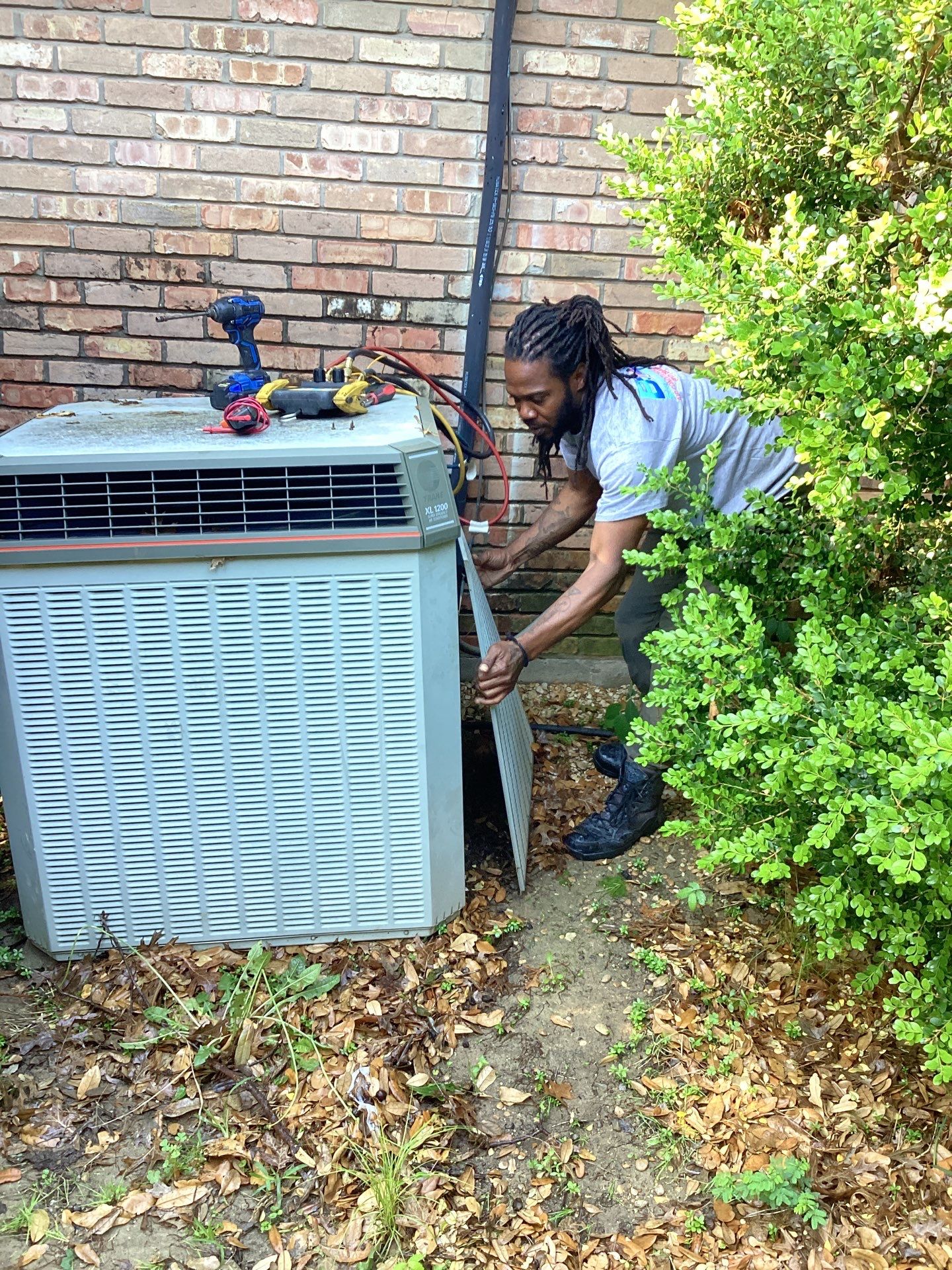 Working on the home owners condensing unit.