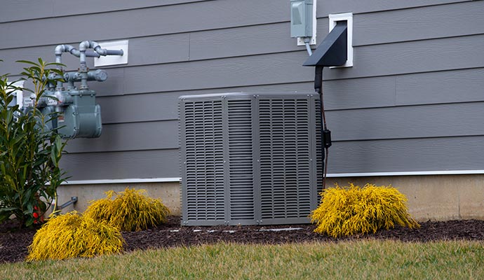 Outdoor ac unit by house wall