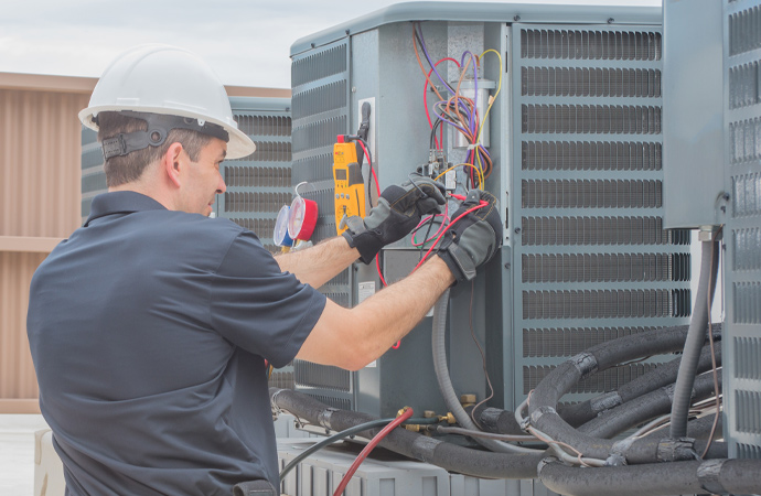 Expert fixing HVAC electrical issues.