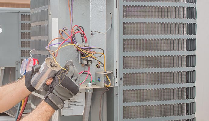 Professional technician repairing heating system