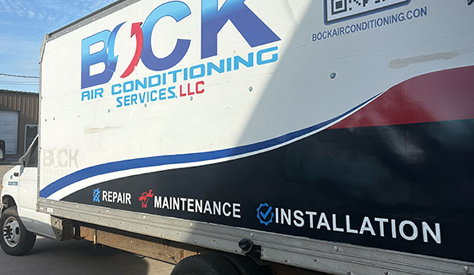 Service truck of Bock Air Conditioning Services in a commercial area