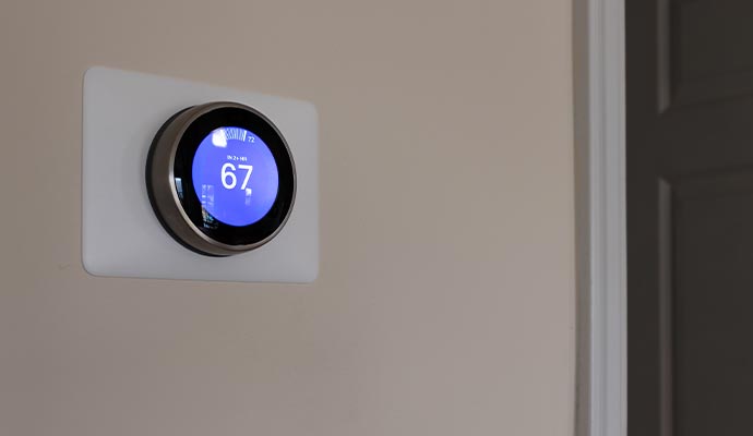  a smart thermostat controlling different room temperatures for energy efficiency.