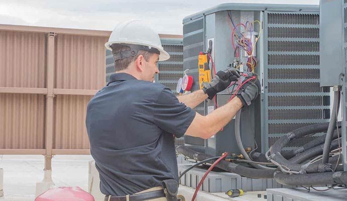Technician repairing heating system